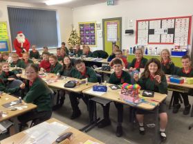 Santa very kindly visits Rm22 during his very busy time to give out Christmas presents for each child which were supplied by Friends of Dromore